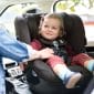 p2-joie-spinning-car-seat-ispin360-coal-toddler-smiling-in-seat_1_1